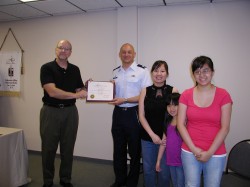 Roberson commanding officer accepts award