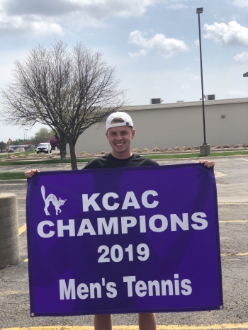 Marcelo Mann - Holding Tennis Championship Banner