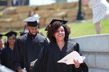 Smiling students at Commencement