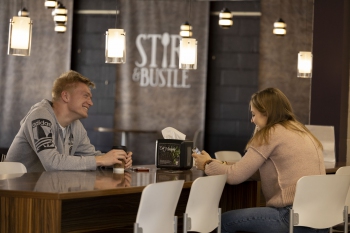 Students studying and talking in Stir & Bustle coffee shop