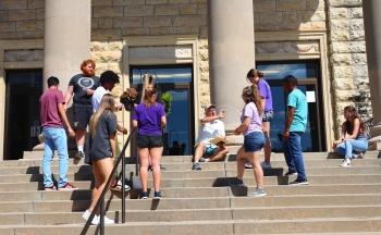 Dr. Ross with Students on Steps